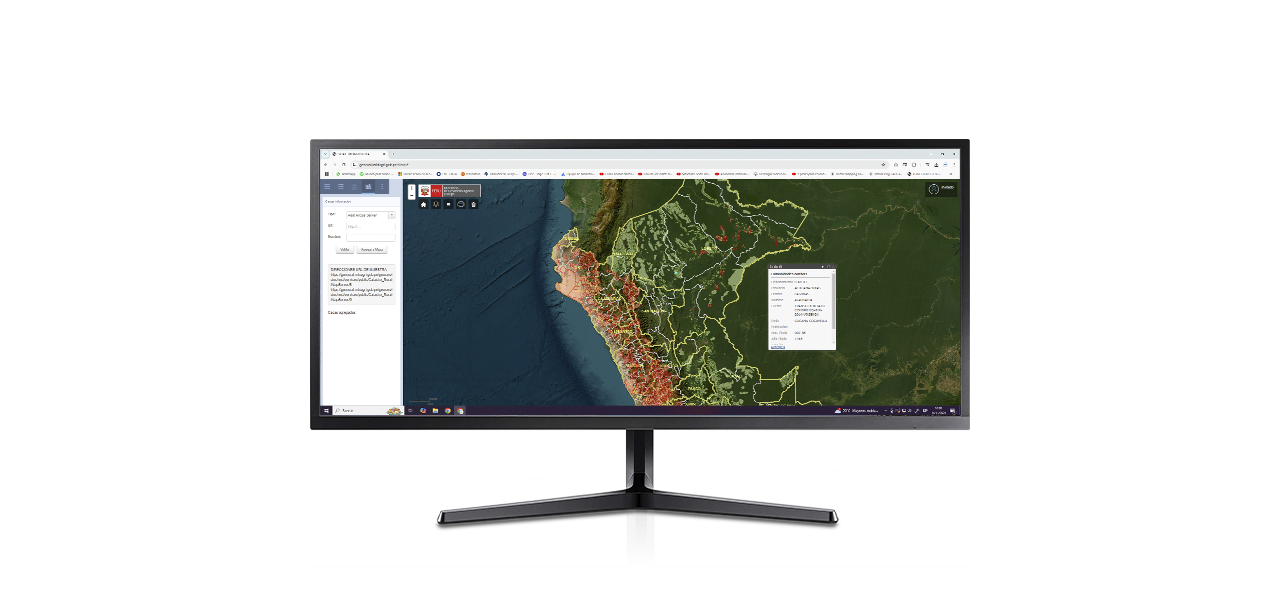 Dos personas que llevan ropa de invierno y equipo de seguridad naranja quitando la nieve acumulada a lo largo de una carretera transitada