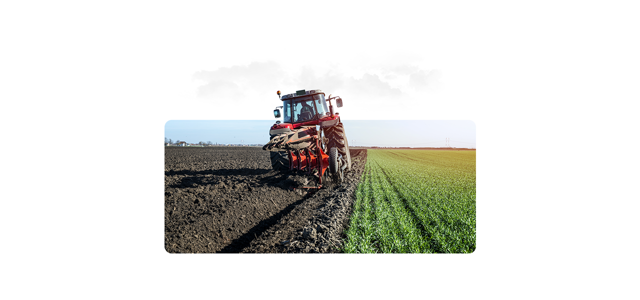 A composite photo of a large sunlit farmland with an overlay of a colorful heat map grid as a drone flies overhead
