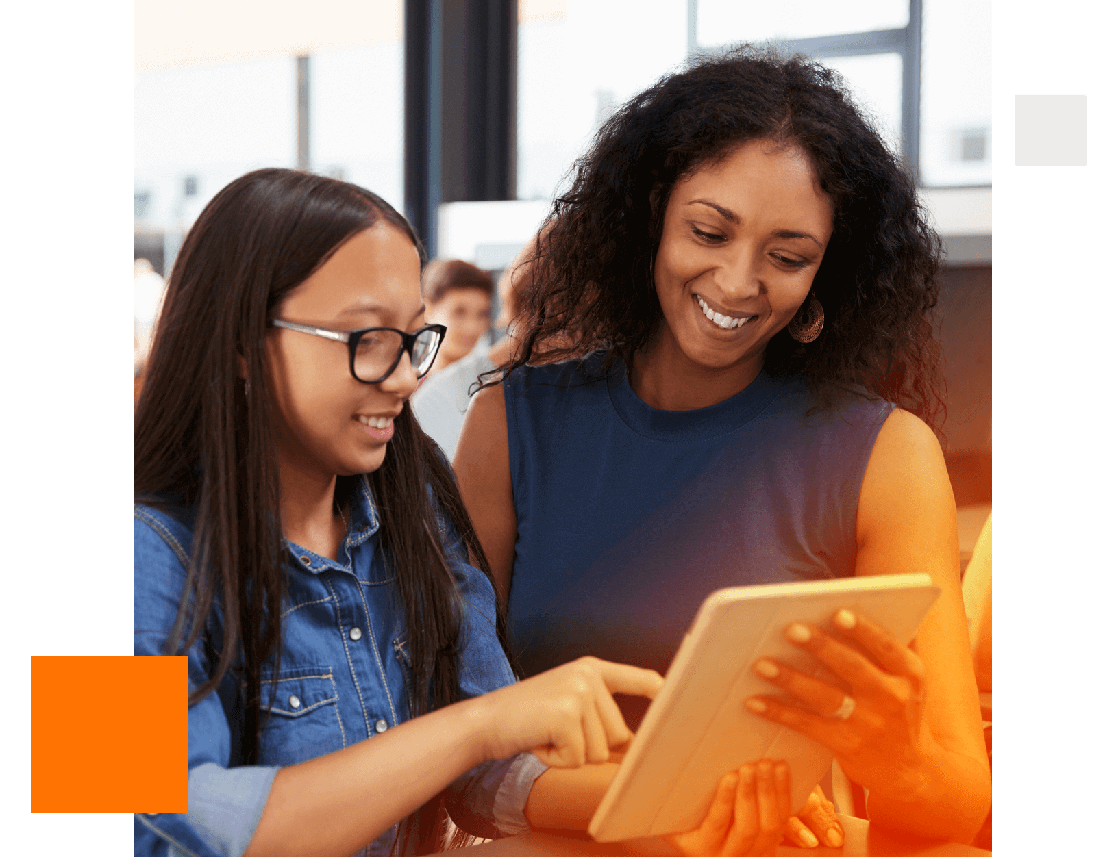 In a classroom full of students, a person looks up at the instructor next to him, and a map of New York City with dots on it