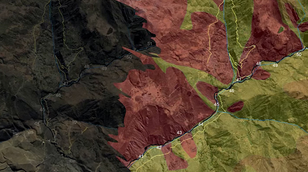 A detailed map with color-coded areas ranging from green to red, indicating different data values across a city region.