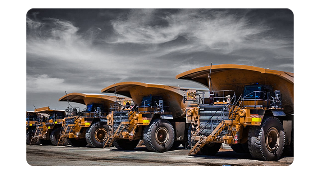A smart phone showing an aerial view of ground transportation for mining trucks and shows the real-time fleet tracking that helps reduces driving and idle time