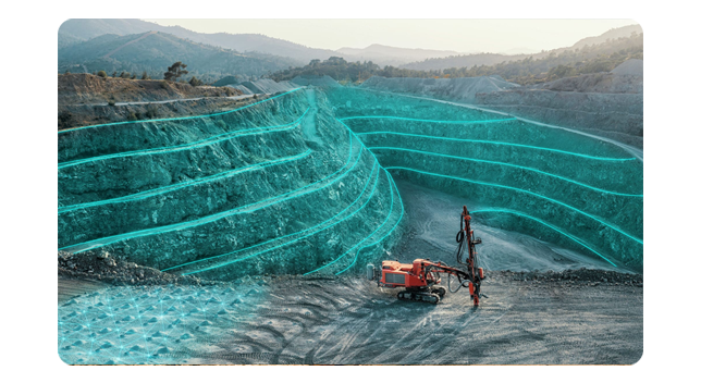 Two fieldworkers standing next to a bulldozer and looking at a tablet
