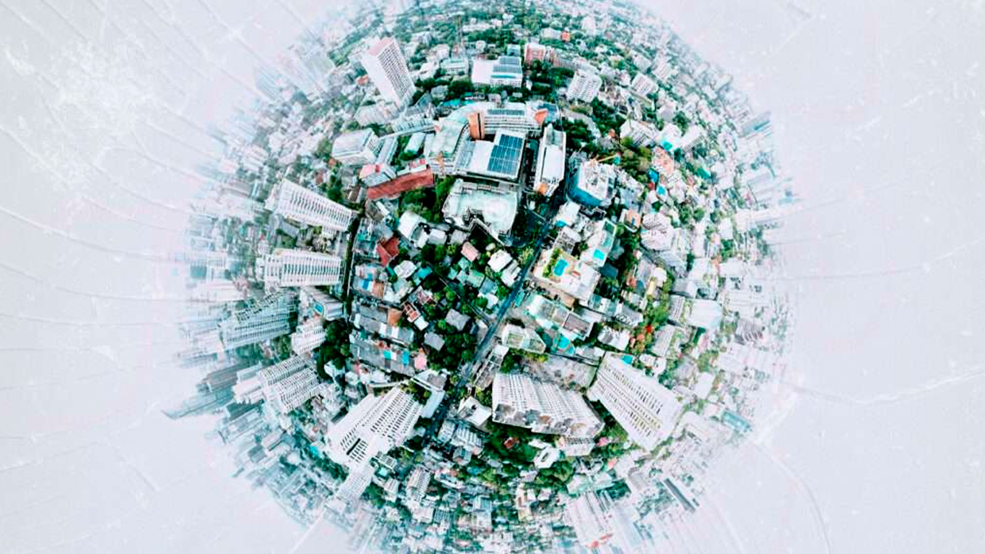 Three young adults smiling while backpacking through a field