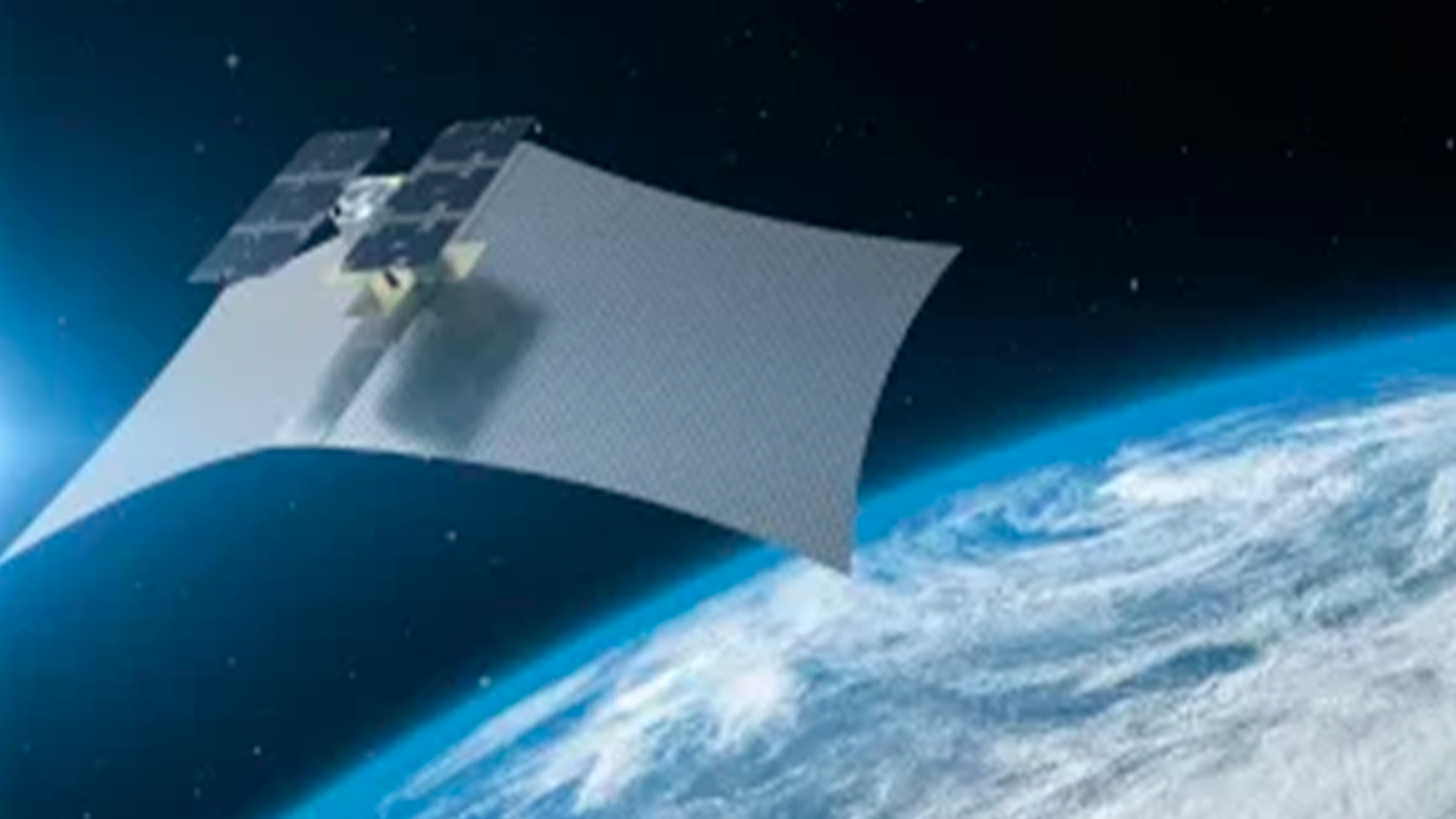 Three young adults smiling while backpacking through a field