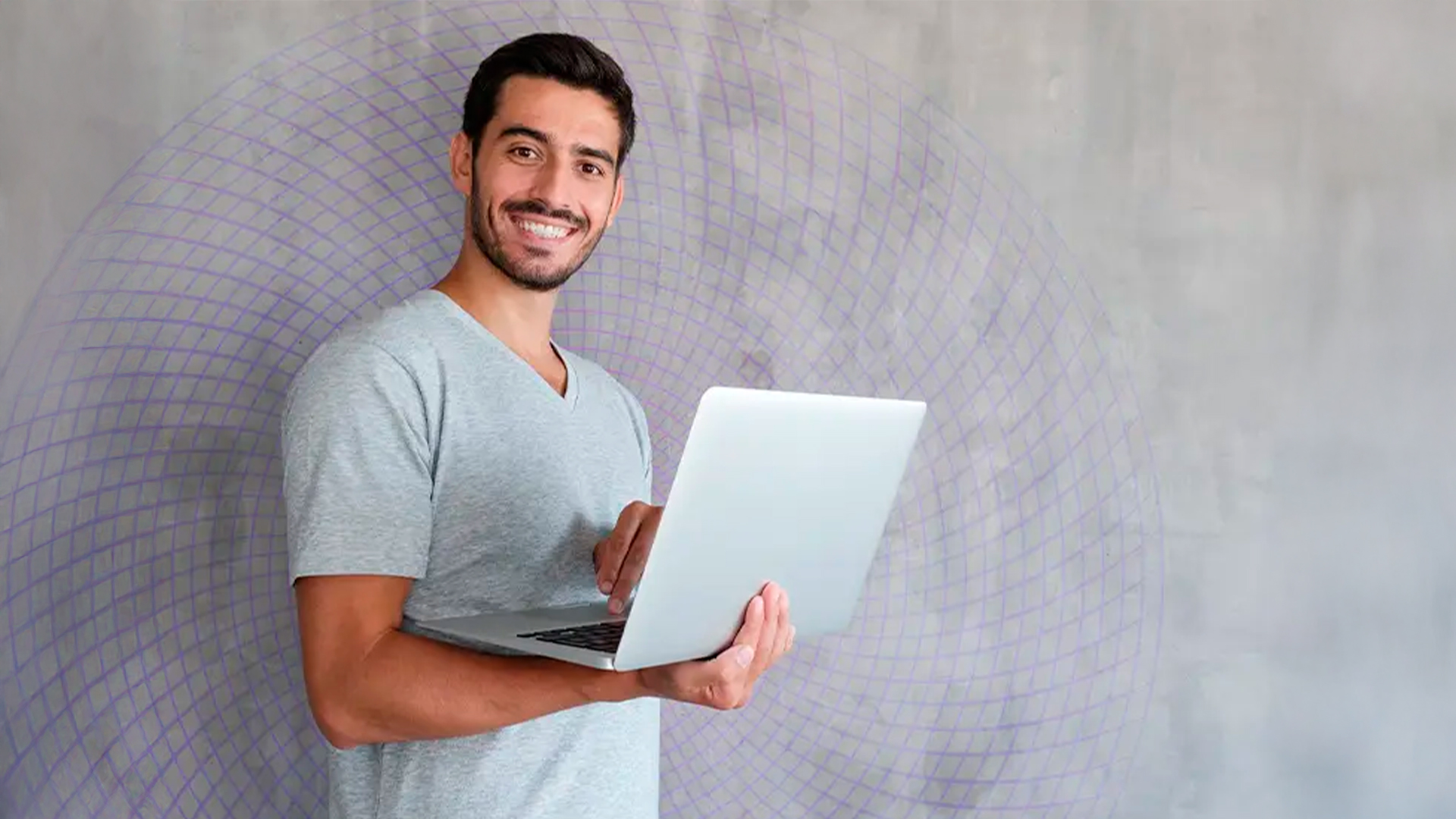 Three young adults smiling while backpacking through a field