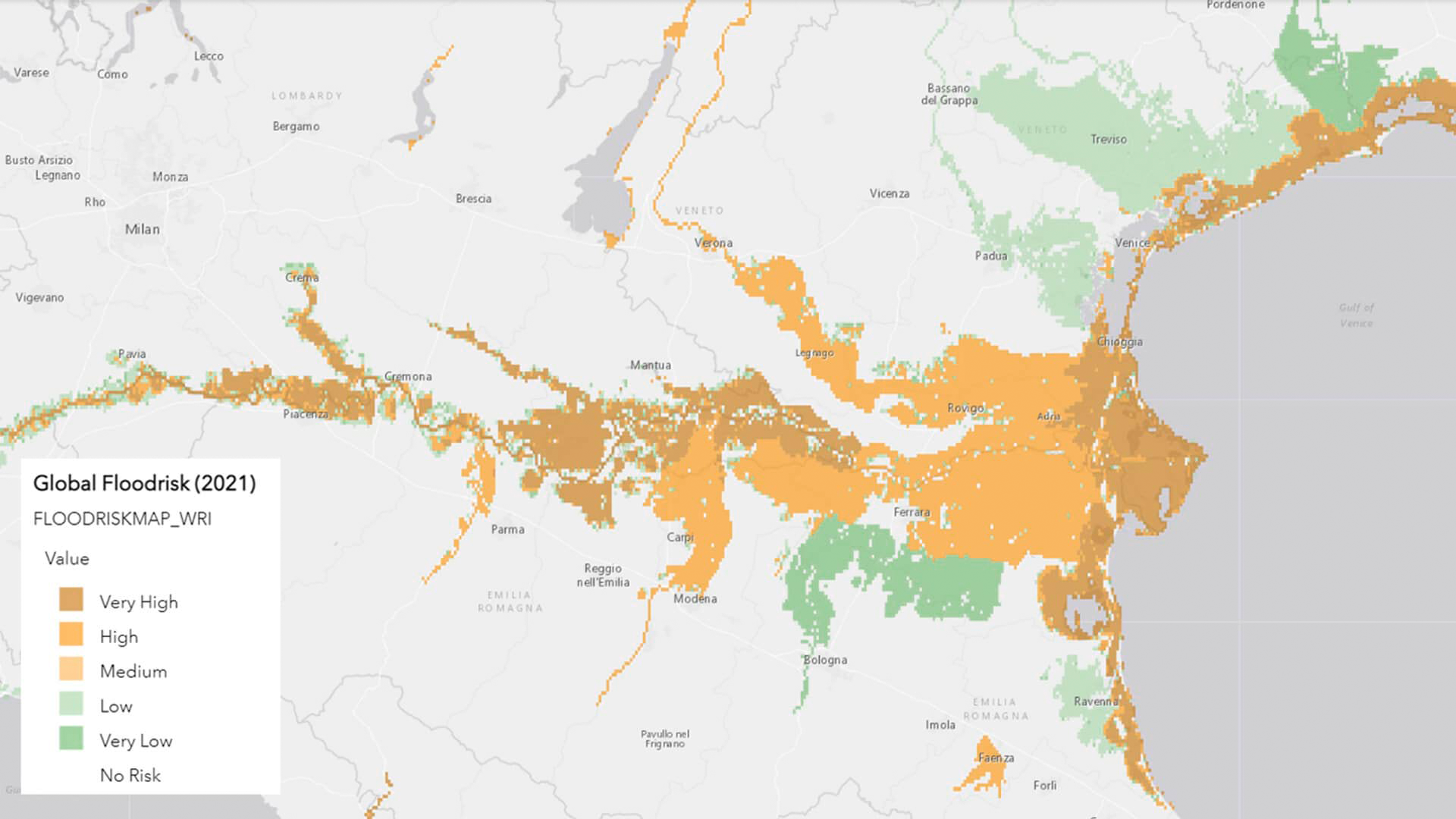 Three young adults smiling while backpacking through a field