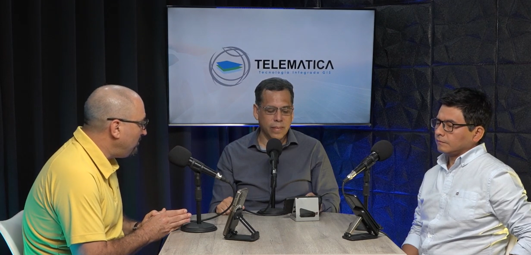 A close up of a diverse group of hands placed one on top of the other, overlayed with a square teal and gray map of Chicago, Illinois