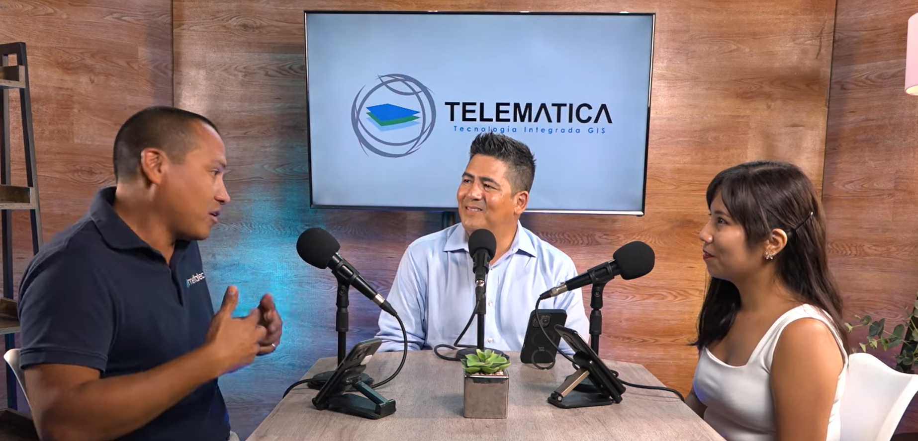 A close up of a diverse group of hands placed one on top of the other, overlayed with a square teal and gray map of Chicago, Illinois