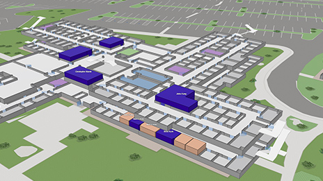 Vista aérea de un edificio de color rosa con cuadros naranjas y verdes que muestran la gestión del espacio y las oficinas codificadas por colores