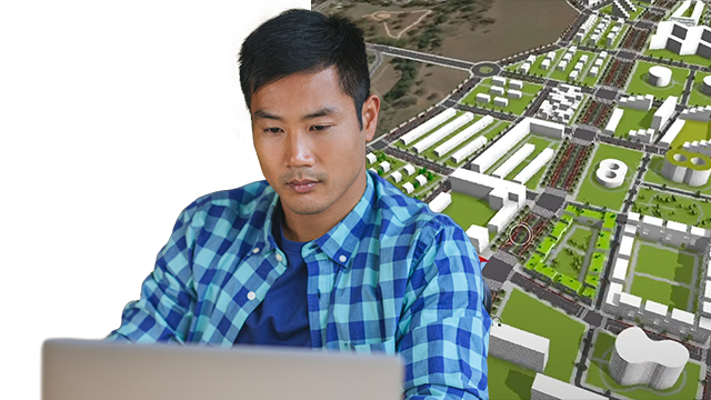 Hombre con camisa a cuadros mirando la pantalla de un portátil con un modelo 3D de una ciudad y edificios blancos de fondo